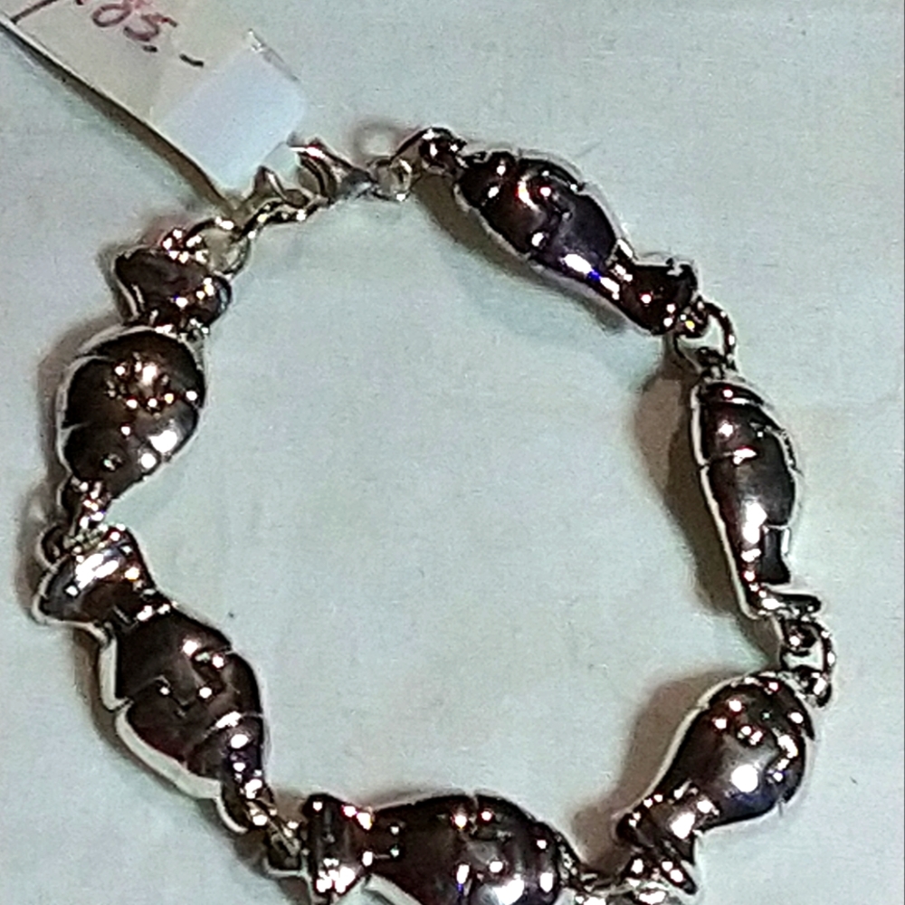 STERLING  ADJUSTABLE BRACELET, PUZZLE MOTIF. .📌41. gm. ADJUSTABLE 7.5 TO 8 IN